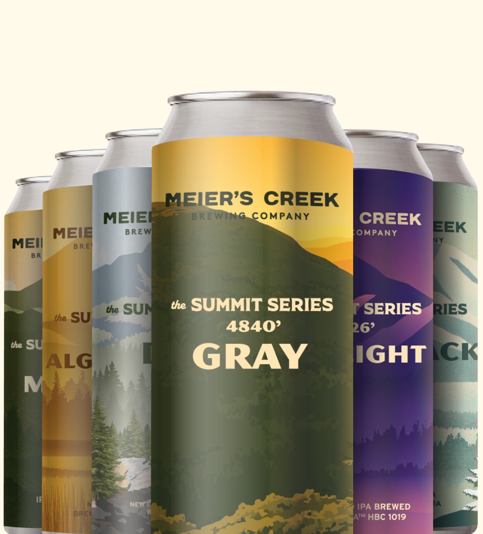 A grouping of six different beer cans with labeling inspired by the Adirondack high peaks, with a golden and green can towards the front bearing the name GRAY in bold letters